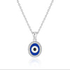Silver necklace with a blue and black evil eye pendant on a white background